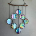 Rainbow hanging wall art decoration made of colorful discs, elegantly arranged for home decor.