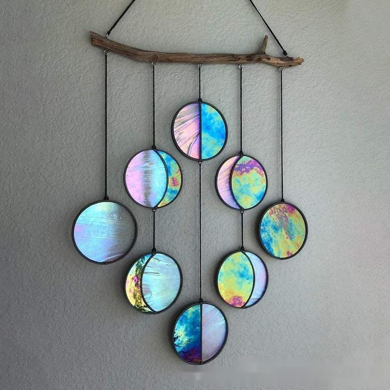 Rainbow hanging wall art decoration made of colorful discs, elegantly arranged for home decor.