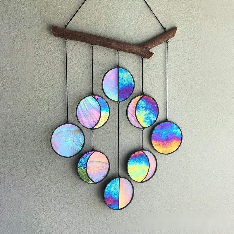 Rainbow hanging wall art decoration featuring colorful circular pendants on a wooden branch.